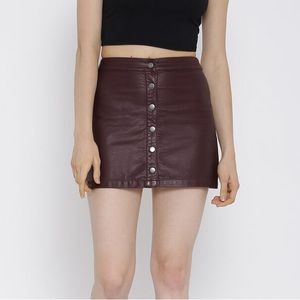 Faux leather button up mini skirt